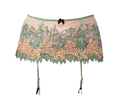 Green and Salmon Floral Embroidered Tulle Garter Belt is practically a flirty skirt; that's why Carol has nicknamed it the Skelt. Trimmed in shiny elastic, our Skelt is unlined and is fastened in the back with black satin ribbon.   Leg adjustable straps feature rose gold hardware and black clips.  For a set, match this style with our Grace Embroidered Tulle Underwire Bra and the Grace Embroidered Tulle Tanga.  A set made to drop any jaw. 